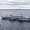 The British aircraft carrier HMS Queen Elizabeth, carrying fifth-generation F-35B Lightning II fighters, has transferred to NATO command for the first time in history-33