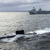 The British aircraft carrier HMS Queen Elizabeth, carrying fifth-generation F-35B Lightning II fighters, has transferred to NATO command for the first time in history-36