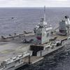 The British aircraft carrier HMS Queen Elizabeth, carrying fifth-generation F-35B Lightning II fighters, has transferred to NATO command for the first time in history-29