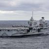 The British aircraft carrier HMS Queen Elizabeth, carrying fifth-generation F-35B Lightning II fighters, has transferred to NATO command for the first time in history-32