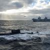 The British aircraft carrier HMS Queen Elizabeth, carrying fifth-generation F-35B Lightning II fighters, has transferred to NATO command for the first time in history-19
