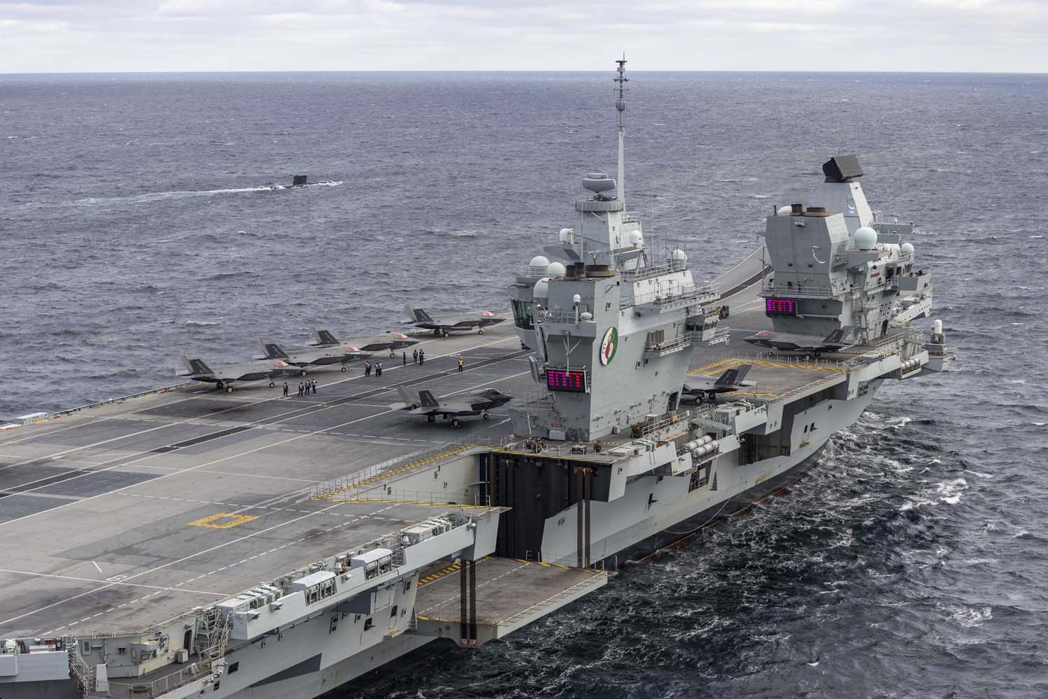 The British aircraft carrier HMS Queen Elizabeth, carrying fifth-generation F-35B Lightning II fighters, has transferred to NATO command for the first time in history-11