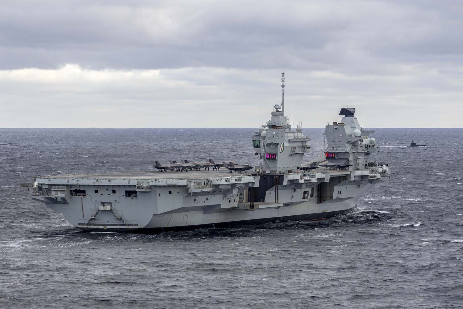 The British aircraft carrier HMS Queen Elizabeth, carrying fifth-generation F-35B Lightning II fighters, has transferred to NATO command for the first time in history-14