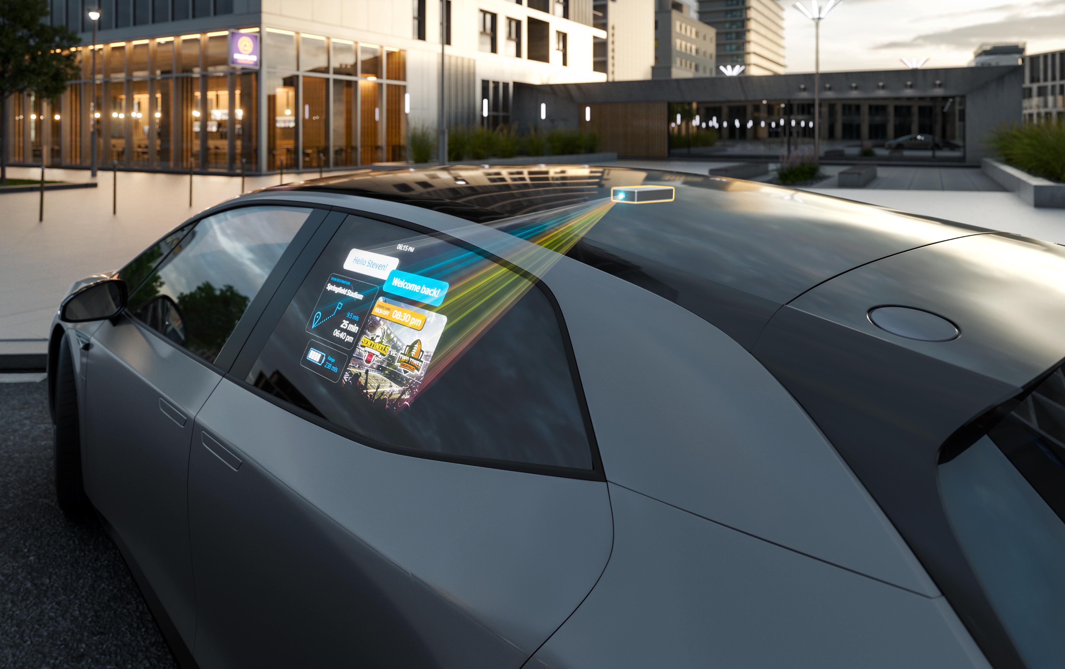 Mini projector shows the image on the side window of the car